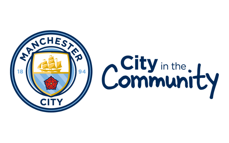 White background with Manchester City logo. Next to the logo reads: "City in the community"